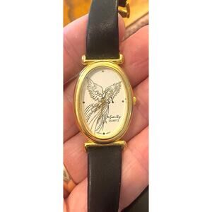VTG Women's 25mm Gold Tone Infinity Watch, Trumpet Blowing Angel On Face